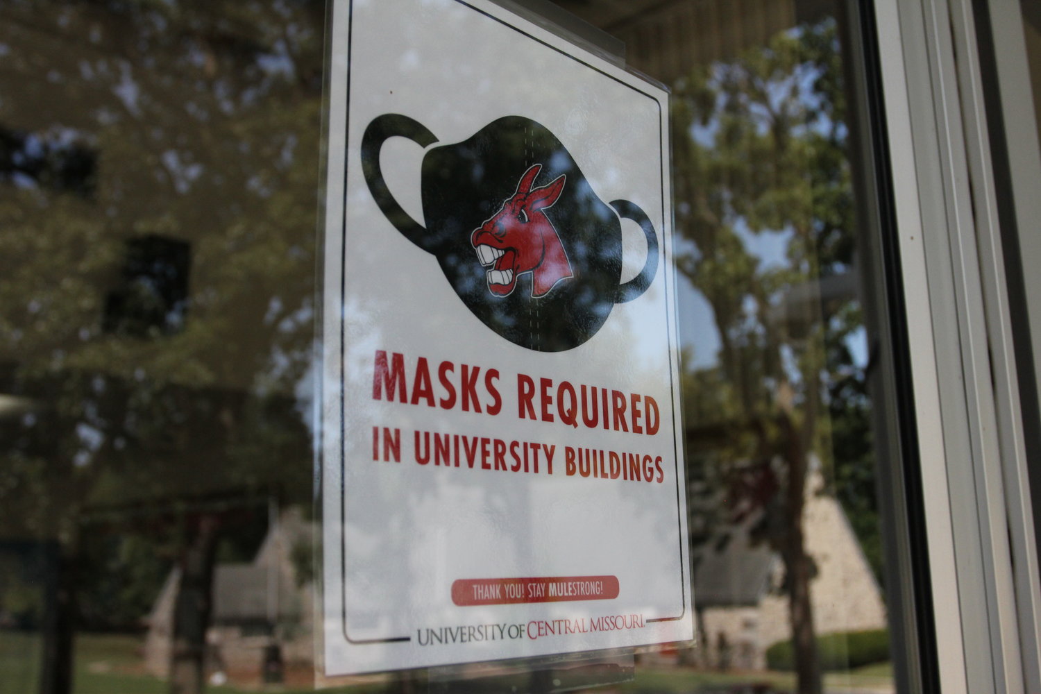 A sign stating masks are required in university buildings is seen at the University of Central Missouri on Thursday during freshman move-in day.